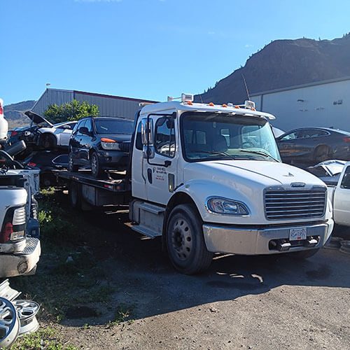 D&G Tire and Auto our truck bringing in a car